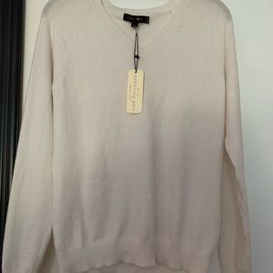 Cream color v-neck sweater. Size medium.